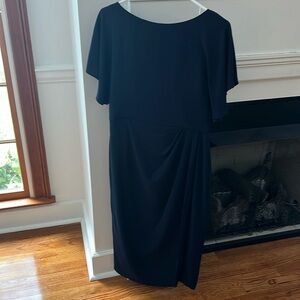 navy midi dress with flutter sleeves and pleated side waist